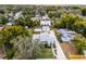 An aerial view of the neighborhood showcasing the home, yard, mature trees and surroundings at 1911 Canton St, Orlando, FL 32803