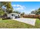 Private backyard with paver patio, green lawn, and wood fence, offering ample space at 1911 Canton St, Orlando, FL 32803
