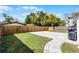 Spacious backyard with a well-maintained lawn, modern paver patio and wooden fence at 1911 Canton St, Orlando, FL 32803