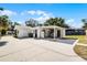 A large backyard boasts a spacious driveway and exterior utility area, ideal for entertaining or adding a personal touch at 1911 Canton St, Orlando, FL 32803