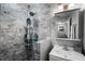 Modern bathroom featuring a vanity, sink, mirror, and beautiful gray and white tiled shower at 1911 Canton St, Orlando, FL 32803