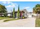 Charming one-story home featuring a bright red door and well-manicured front yard at 1911 Canton St, Orlando, FL 32803