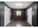 Hallway with tile floors, neutral wall color, and a window for natural light at 1911 Canton St, Orlando, FL 32803