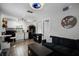 Living room with a comfortable black sofa at 1911 Canton St, Orlando, FL 32803