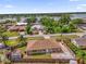 An aerial view of the property showing the neighboring lake and community at 2098 Heathwood St, Deltona, FL 32725