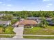 Aerial view of the home, showcasing the manicured lawn and property at 2098 Heathwood St, Deltona, FL 32725