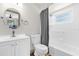 Bright bathroom with a shower and tub combination, a toilet and a sink at 2098 Heathwood St, Deltona, FL 32725