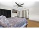 Bright bedroom featuring a ceiling fan, TV and ensuite bathroom at 2098 Heathwood St, Deltona, FL 32725