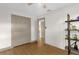 Bedroom featuring ceiling fan, closet and view into hallway at 2098 Heathwood St, Deltona, FL 32725