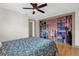 Bedroom featuring ceiling fan and closet with organization and shelves at 2098 Heathwood St, Deltona, FL 32725