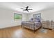 Cozy bedroom featuring a ceiling fan, and natural light from two windows at 2098 Heathwood St, Deltona, FL 32725