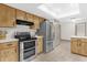 Modern kitchen featuring stainless steel appliances, ample counter space, and natural lighting at 2098 Heathwood St, Deltona, FL 32725