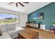 Comfortable living room boasting a modern entertainment center, large window, and neutral colors at 2098 Heathwood St, Deltona, FL 32725