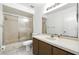 Well-lit bathroom with a shower-tub combo, single sink vanity, and a mirror at 22 Bradford Ct, Kissimmee, FL 34758