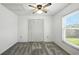 Cozy bedroom with carpet, ceiling fan, closet and natural light from the window at 22 Bradford Ct, Kissimmee, FL 34758