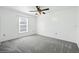 Bright bedroom with a ceiling fan and a window providing natural light at 22 Bradford Ct, Kissimmee, FL 34758