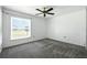 Clean bedroom with a ceiling fan and a window for natural light at 22 Bradford Ct, Kissimmee, FL 34758