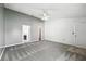 Spacious bedroom with carpet, ceiling fan, and views into the kitchen at 22 Bradford Ct, Kissimmee, FL 34758