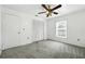 This bedroom features neutral carpet, a ceiling fan and closet at 22 Bradford Ct, Kissimmee, FL 34758