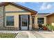 The main entrance features a screen enclosed porch, offering additional living space at 22 Bradford Ct, Kissimmee, FL 34758
