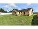 Exterior view of home showcasing lush lawn and clean design at 22 Bradford Ct, Kissimmee, FL 34758