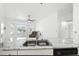 Bright kitchen with stainless sink, marble countertops, and view into the living area at 22 Bradford Ct, Kissimmee, FL 34758