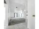 Open-concept living room with tile entry and carpet, bright and airy space at 22 Bradford Ct, Kissimmee, FL 34758