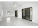 Bright living room with tile flooring, ceiling fan, sliding glass doors and a window at 22 Bradford Ct, Kissimmee, FL 34758