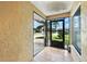 Screened porch with tile flooring provides views of the surrounding yard and neighborhood at 22 Bradford Ct, Kissimmee, FL 34758
