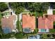 Aerial view of a neighborhood with tile roofs, swimming pools, and green landscaping at 2256 Kettle Dr, Orlando, FL 32835