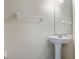 Bright bathroom with pedestal sink, a towel rack, and neutral paint at 2256 Kettle Dr, Orlando, FL 32835