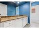 Bathroom features granite countertops, blue walls, and a white vanity at 2256 Kettle Dr, Orlando, FL 32835