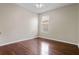This bedroom has hardwood floors, neutral walls and a ceiling fan at 2256 Kettle Dr, Orlando, FL 32835
