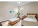 This cozy bedroom features a ceiling fan, hardwood floors and natural light at 2256 Kettle Dr, Orlando, FL 32835
