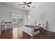 Light bedroom features wood floors, desk, and access to an outdoor patio area at 2256 Kettle Dr, Orlando, FL 32835