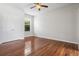 The bedroom offers beautiful wood-look floors and natural light from the window at 2256 Kettle Dr, Orlando, FL 32835