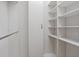 The organized walk-in closet features a built-in shelving system at 2256 Kettle Dr, Orlando, FL 32835