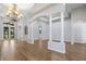 Bright dining room features columns, wood floors, and chandelier at 2256 Kettle Dr, Orlando, FL 32835