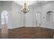 Bright dining room features a chandelier, tray ceiling, and wood floors at 2256 Kettle Dr, Orlando, FL 32835