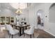 Bright dining room features a black table and white chairs at 2256 Kettle Dr, Orlando, FL 32835