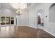 Bright dining room features a chandelier, arched doorways and wood floors at 2256 Kettle Dr, Orlando, FL 32835