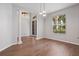 This empty room features tiled flooring, a large window, decorative pillars, and modern lighting fixtures at 2256 Kettle Dr, Orlando, FL 32835