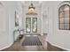 Welcoming foyer with decorative front doors, tiled flooring and decorative lighting at 2256 Kettle Dr, Orlando, FL 32835