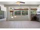 Bright game room with large windows overlooking the pool, and neutral-colored tile flooring at 2256 Kettle Dr, Orlando, FL 32835