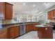 The kitchen is equipped with granite countertops, stainless steel appliances, an island and decorative lighting at 2256 Kettle Dr, Orlando, FL 32835