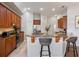 Spacious kitchen featuring stainless steel appliances, a breakfast bar, and ample cabinet space for a practical cooking area at 2256 Kettle Dr, Orlando, FL 32835