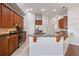 Spacious kitchen featuring stainless steel appliances, a breakfast bar, and ample cabinet space for a practical cooking area at 2256 Kettle Dr, Orlando, FL 32835