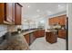 Well-equipped kitchen boasting granite countertops, stainless steel appliances, and ample cabinet space for culinary enthusiasts at 2256 Kettle Dr, Orlando, FL 32835
