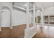Bright living area features tray ceilings, white columns, and wood flooring at 2256 Kettle Dr, Orlando, FL 32835