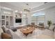Bright, open living room features a large window, hardwood floors, and built-in shelving at 2256 Kettle Dr, Orlando, FL 32835